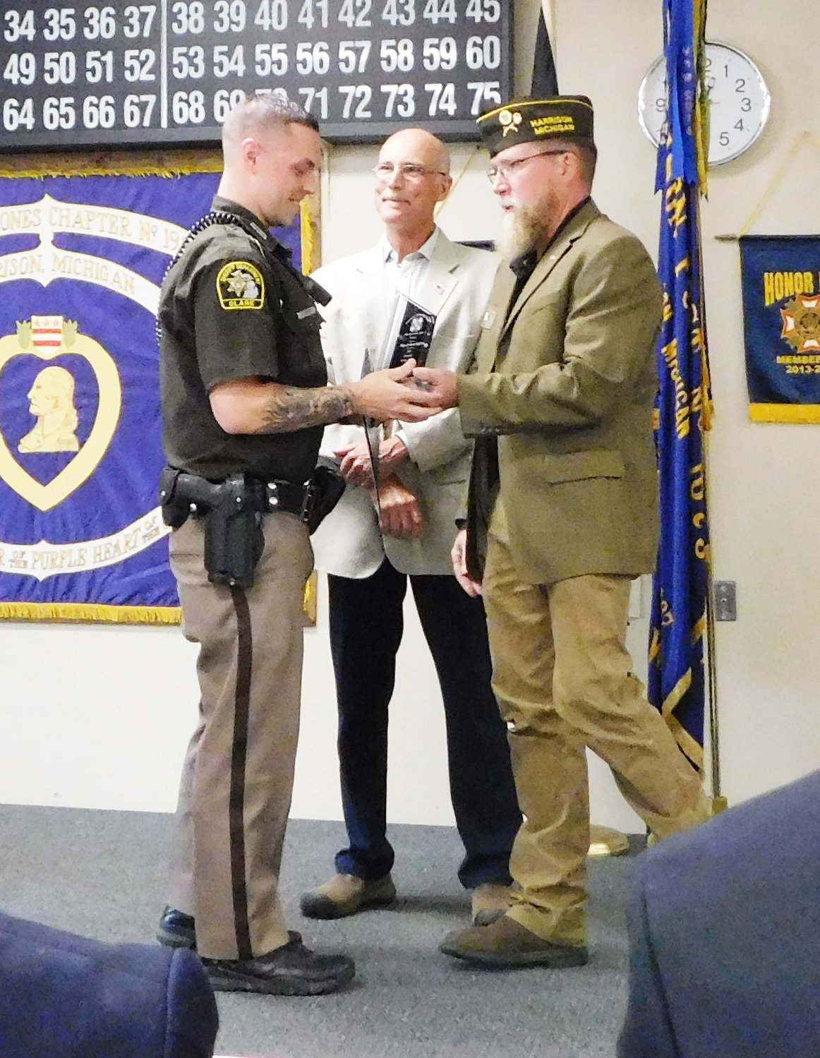 Deputy Josh Riffe receives his award from Scott Taylor.